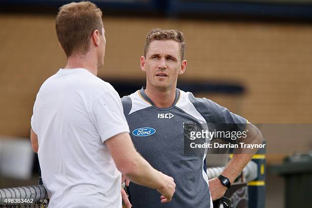 Joel Selwood of the Cats speaks with his brother and assitant coach Adam during a Geelong Cats AFL pre-season training session at Kardinia Park on...