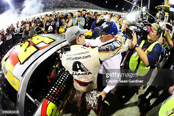 Jeff Gordon, driver of the AXALTA Chevrolet, hugs team owner Rick Hendrick after the NASCAR Sprint Cup Series Ford EcoBoost 400 at Homestead-Miami...