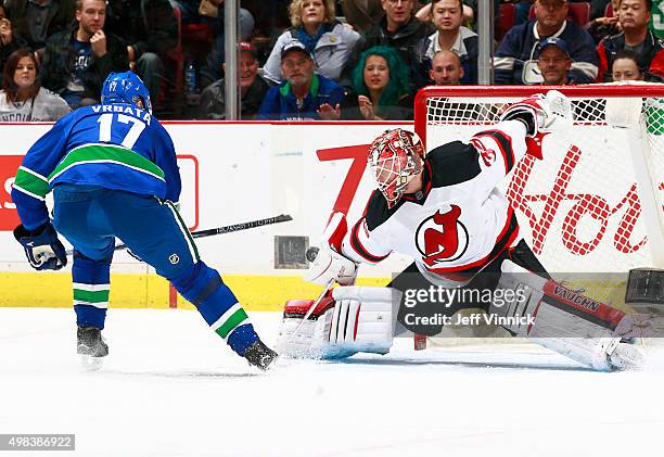 Cory Schneider of the New Jersey Devils stops Radim Vrbata of the Vancouver Canucks on a penalty shot during their NHL game at Rogers Arena November...