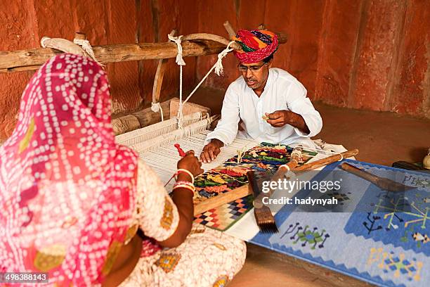 indian couple weaving textiles (durry). salawas village. rajasthan - textile industry stock pictures, royalty-free photos & images