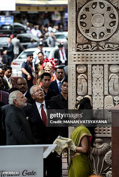 Indian Prime Minister Narendra Modi and Malaysia's Prime Minister Najib Razak look at the architecture after inaugurating the "Torana Gate",...