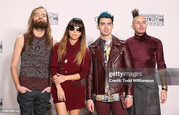 Recording artists Jack Lawless, JinJoo Lee, Joe Jonas and Cole Whittle of music group DNCE pose in the press room during the 2015 American Music...