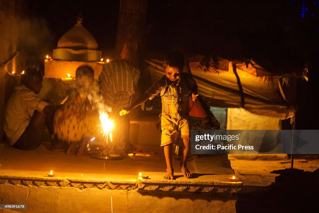 A family celebrates Ekadashi festival ( 11th day of Diwali...