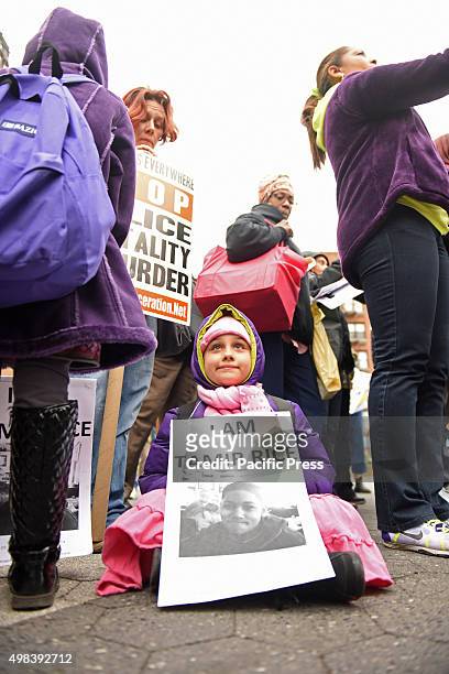 Am Tamir Rice" sign. Stop Mass Incarcerations Network sponsored a children's march demanding accountability on the one year anniversary of Tamir...