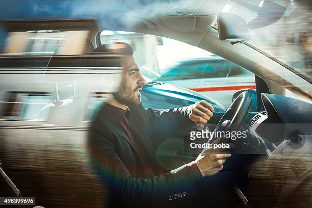businessman driving car - rijden een motorvoertuig besturen stockfoto's en -beelden