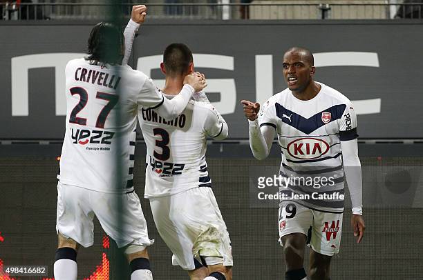 Diego Contento of Bordeaux celebrates his goal with teammates Enzo Crivelli and Nicolas Maurice-Belay during the French Ligue 1 match between Stade...