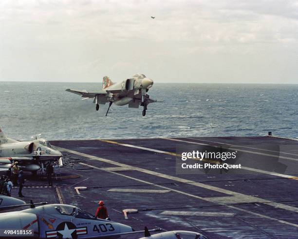 An F-4 Phantom II aircraft approaches for a landing aboard the attack aircraft carrier USS John F Kennedy , mid 20th century.