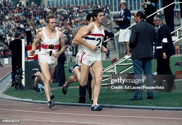 Brendan Foster of Great Britain leads Heinz Mortl of West Germany in the men's 1500 metres during an athletics meet at Crystal Palace in London on...
