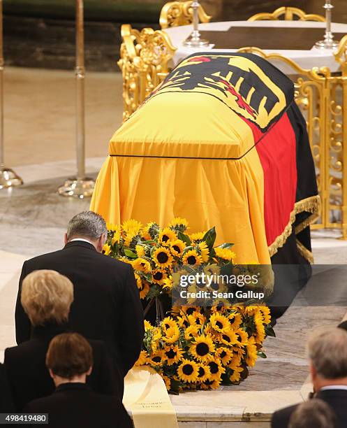 German President Joachim Gauck bows at the coffin of former German Chancellor Helmut Schmidt prior to the funeral service at Sankt Michaelis church...