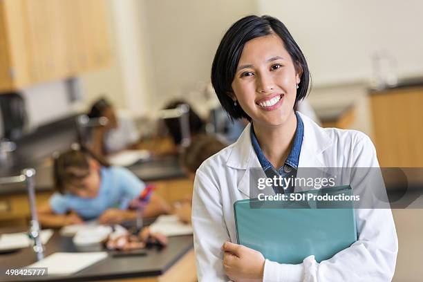 asian science teacher in modern elementary classroom - folder mockup stock pictures, royalty-free photos & images