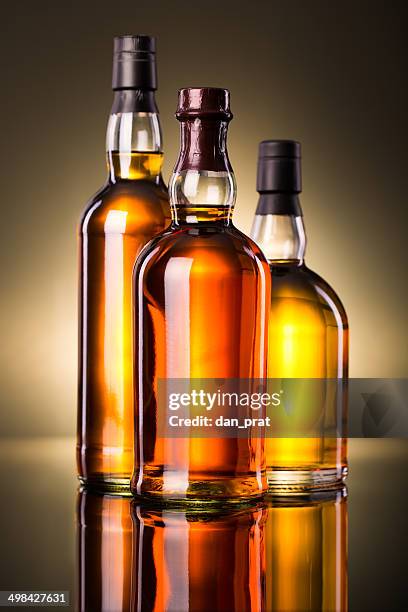 whiskey bottles - drink bottle stock pictures, royalty-free photos & images