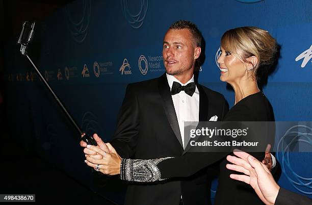 Lleyton Hewitt and Bec Hewitt take a selfie as they arrive at the 2015 Newcombe Medal at Crown Palladium on November 23, 2015 in Melbourne, Australia.