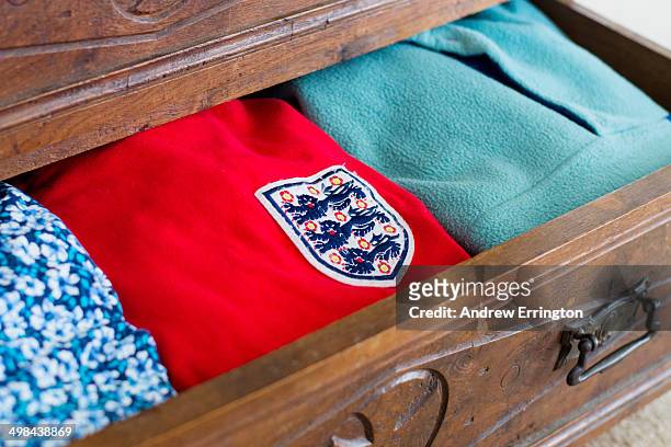 Football fan's replica 1966 England football shirt in chest of drawers awaiting World Cup match day