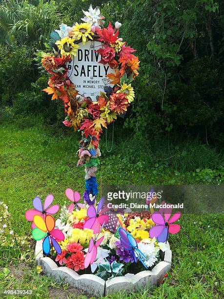 Makeshift roadside memorial to someone who died in an auto accident at that spot in Ponte Vedra Beach, Florida.
