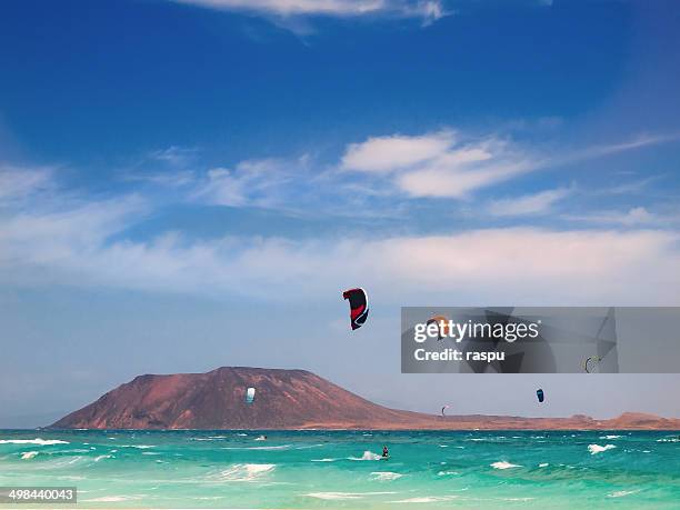 kitesurfers in fuerteventura island - kite surfing stock pictures, royalty-free photos & images