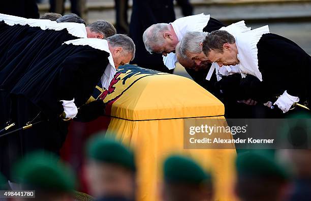 Pallbearers carry the coffin of former German Chancellor Helmut Schmidt out of Sankt Michaelis church following a state memorial ceremony on November...