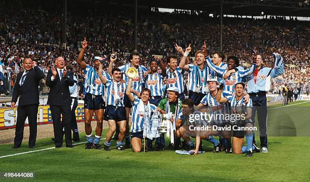 The Coventry City squad celebrate with the trophy after the 1987 FA Cup Final between Coventry City and Tottenham Hotspur at Wembley Stadium on May...