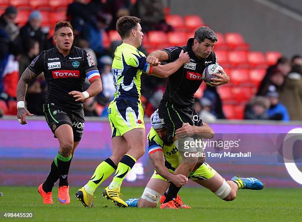 Bryn Evans of Sale Sharks tackles Jean Bouilhou of Pau during the European Rugby Challenge Cup match between Sale Sharks and Pau at AJ Bell Stadium...