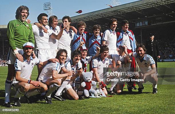 The West Ham United team posing with the trophy after their FA Cup Final victory over Arsenal at Wembley Stadium in London on 10th May 1980, West Ham...