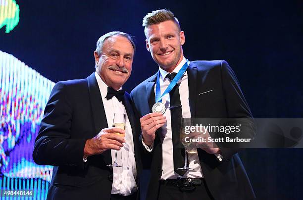 Sam Groth, winner of the Newcombe Medal and John Newcombe pose on stage at the 2015 Newcombe Medal at Crown Palladium on November 23, 2015 in...