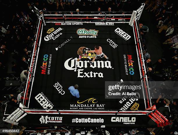 Miguel Cotto and Canelo Alvarez exchange punches during their Middleweight Bout at Mandalay Bay Casino on November 21, 2015 in Las Vegas, Nevada.