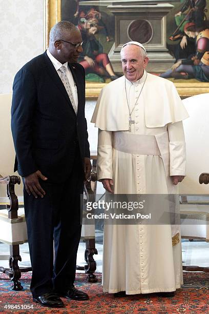 Pope Francis meets Governor-General of Antigua and Barbuda Sir Rodney Williams at his private library in the Apostolic Palace on November 23, 2015 in...