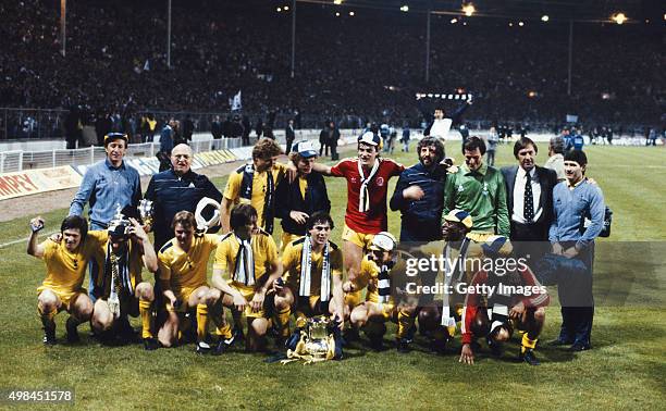 The Tottenham Hotspur squad and management celebrate with the trophy after the 1982 FA Cup Final Replay between Tottenham Hotspur and Queens Park...