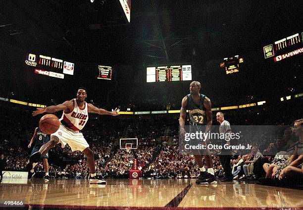 Scottie Pippen of the Portland Trailblazers moves for the ball as he guards Joe Smith of the Minnesota Timberwolves at the Rose Garden in Portland,...