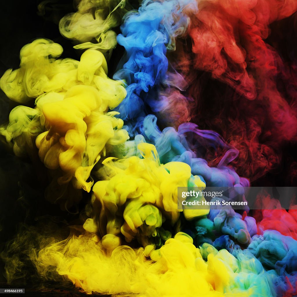 Coloured smoke mixing in dark room