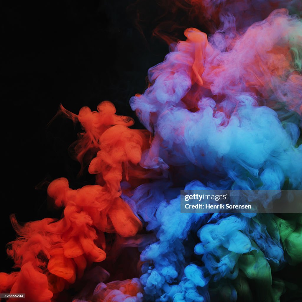 Coloured smoke mixing in dark room