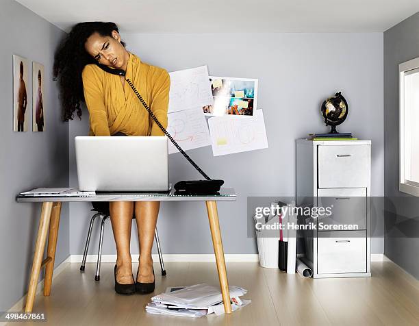 business woman in small office - busy woman stockfoto's en -beelden