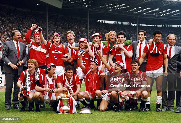 Manchester United manager Ron Aatkinson back row joins his team in the celebrations after the 1985 FA Cup Final between Manchester United and Everton...