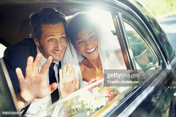 sending them off - bride and groom wedding car stock pictures, royalty-free photos & images