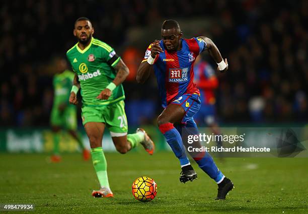 Yannick Bolasie of Crystal Palace is purseud by Yann M'Vila of Sunderland during the Barclays Premier League match between Crystal Palace and...