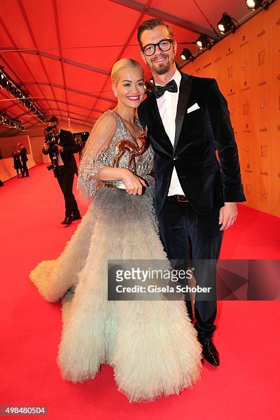 Rita Ora with award and Joko Winterscheidt during at the Bambi Awards 2015 winners board at Stage Theater on November 12, 2015 in Berlin, Germany.