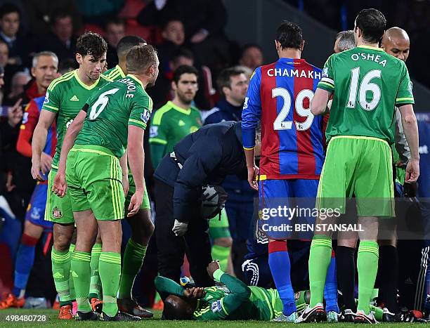 Sunderland's English striker Jermain Defoe receives medical attention after picking up an injury during the English Premier League football match...