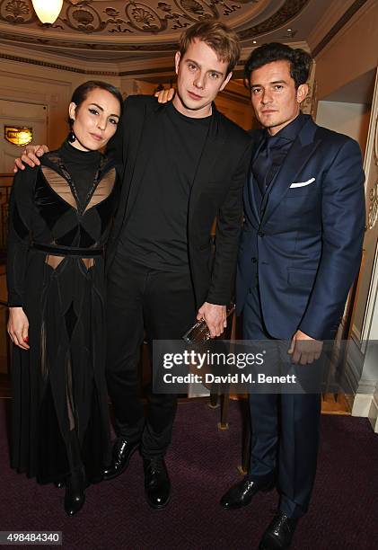 Noomi Rapace, Jonathan JW Anderson, winner of both the Menswear and Womenswear Designer of the Year awards, and Orlando Bloom attend the British...