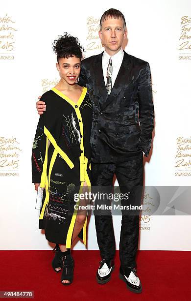 Twigs and Jefferson Hack pose in the Winners Room at the British Fashion Awards 2015 at London Coliseum on November 23, 2015 in London, England.