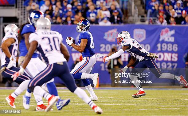Rueben Randle of the New York Giants in action against Devin McCourty of the New England Patriots on November 15, 2015 at MetLife Stadium in East...
