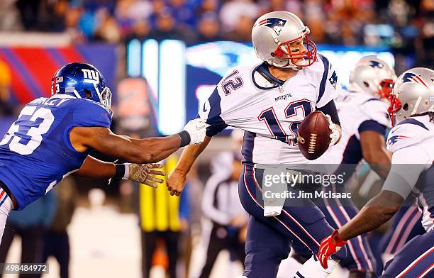 Tom Brady of the New England Patriots in action against Jasper Brinkley of the New York Giants on November 15, 2015 at MetLife Stadium in East...