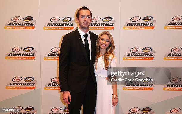 Driver Ben Kennedy and girlfriend Chelsea Saunders pose on the red carpet during the NASCAR Camping World Truck Series and XFINITY Series Banquet at...