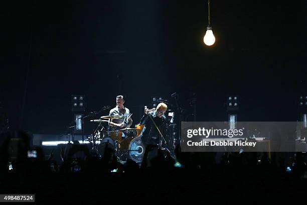 Musicians The Edge, Larry Mullen Jr., Bono and Adam Clayton of U2 perform onstage at 3 Arena on November 23, 2015 in Dublin, Ireland.