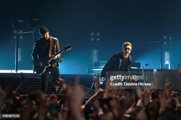 Musicians The Edge and Bono of U2 perform onstage at 3 Arena on November 23, 2015 in Dublin, Ireland.