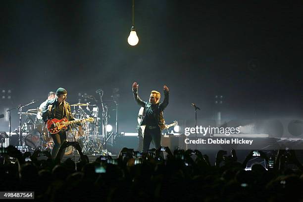 Musicians The Edge, Larry Mullen Jr., Bono and Adam Clayton of U2 perform onstage at 3 Arena on November 23, 2015 in Dublin, Ireland.