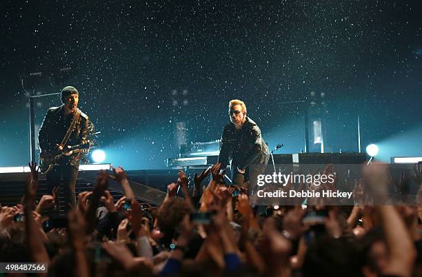 Musicians The Edge and Bono of U2 perform onstage at 3 Arena on November 23, 2015 in Dublin, Ireland.