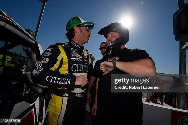 Ruben Pardo, driver of the BYB Chevrolet, stands on the grid during qualifying for the NASCAR Camping World Truck Series Lucas Oil 150 at Phoenix...