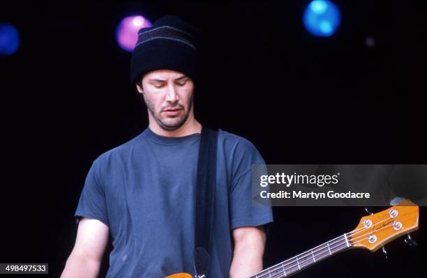 Keanu Reeves performs on stage with his band Dogstar, Glastonbury Festival, United Kingdom, 1994.