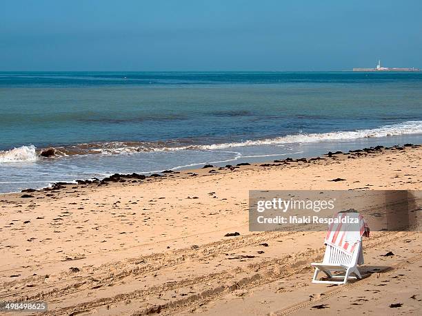 solitary beach - iñaki respaldiza stock pictures, royalty-free photos & images