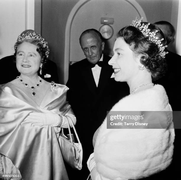 Queen Elizabeth II and the Queen Mother attend a performance at RADA , to celebrate the drama school's Diamond Jubilee , London, UK, November 1964.