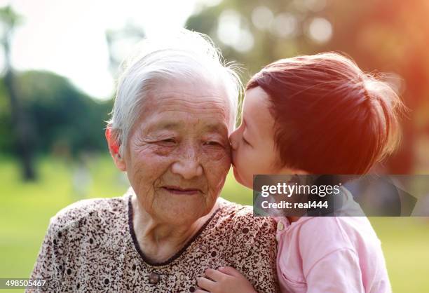 happy asian family - real people family portraits stockfoto's en -beelden